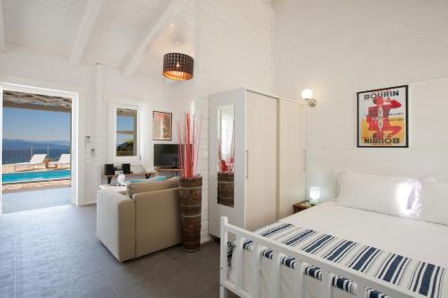 TV a/nebo společenská místnost v ubytování Vasiliki Cottages