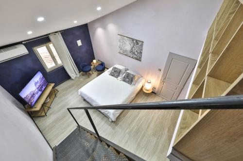 Ένα ή περισσότερα κρεβάτια σε δωμάτιο στο Maison d'hôtes 1800