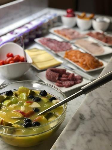 a buffet of different types of food on a table at Boutique Hotel Caelus VII in Tongeren