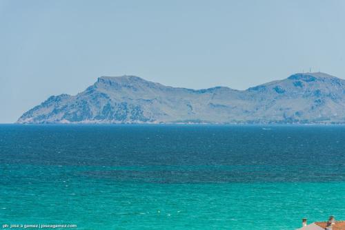 an island in the middle of a large body of water at Hotel Vista Park in Can Picafort