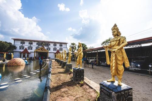 a group of statues in front of a building at Thambu Illam in Jaffna