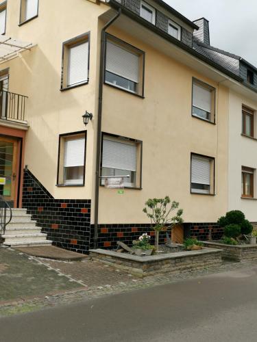 a yellow house with windows on the side of it at Lisa in Bremm