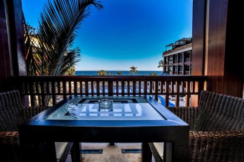 a wooden bench sitting in front of a window at GRAN HOTEL GUADALPIN BANUS, Marbella in Marbella