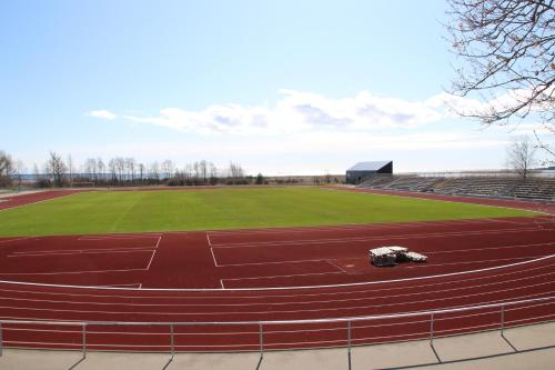 a stadium with a running track in a field at Staadioni Hotel in Kuressaare