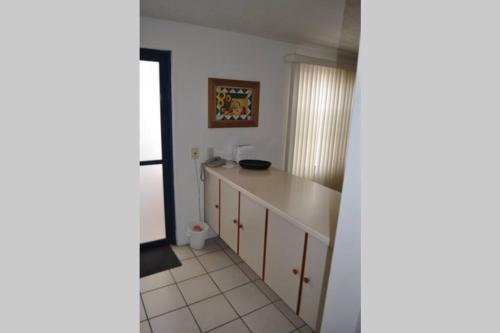 a kitchen with a white counter top in a room at Suite Incomparable Bernardo Quintana 30D in Mendiola