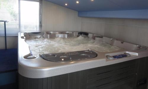 a bathroom with a sink in a counter top at Les Wyllos in Thiéblemont-Farémont