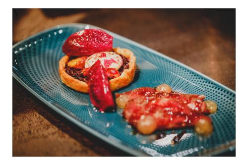a blue plate with two pastries on a table at Vergissmeinnicht in Oberhof