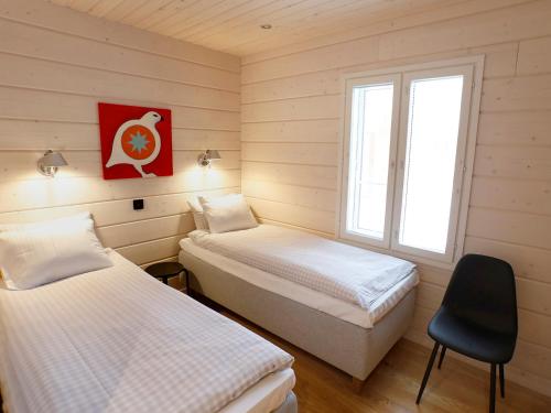 Vuode tai vuoteita majoituspaikassa Lapland Dream Villas