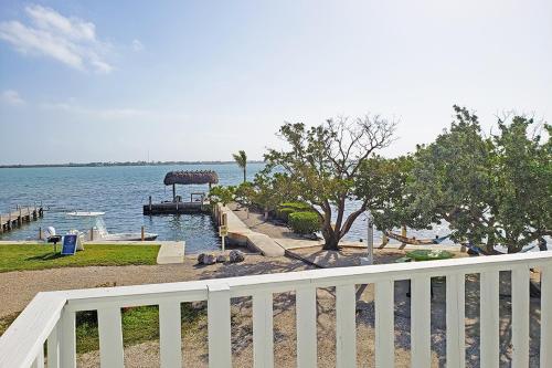a view of a body of water with a white fence at Parmer's Resort in Little Torch Key