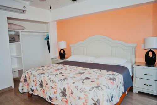 Ένα ή περισσότερα κρεβάτια σε δωμάτιο στο ENNA INN IXTAPA DEPARTAMENTOS ViSTA AL MAR