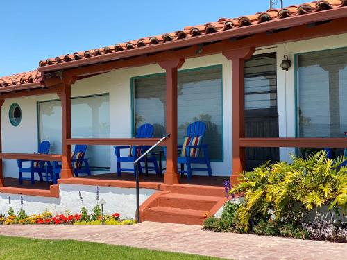 a house with blue chairs on the porch at Beachcomber Inn in San Clemente