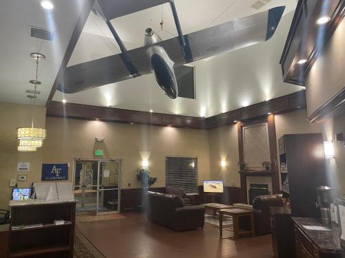 a lobby with a couch and chairs in a room at Baymont by Wyndham Colorado Springs in Colorado Springs