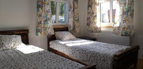 Ένα ή περισσότερα κρεβάτια σε δωμάτιο στο Sławkowo