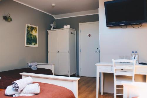 TV a/nebo společenská místnost v ubytování Guesthouse Mõisa Ait
