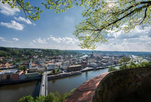 a view of a city with a bridge over a river at Landgasthof Zum Kirchenwirt in Kellberg