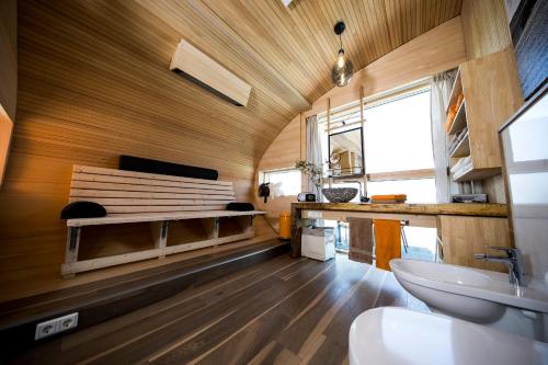 a bathroom with a sink and a toilet in a room at UFO47 in Königsberg in Bayern