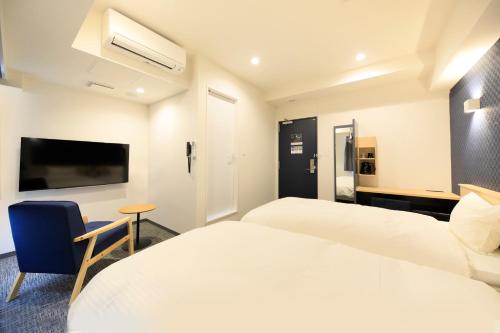Ένα ή περισσότερα κρεβάτια σε δωμάτιο στο Hotel NewNagano NeXT
