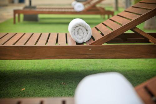 a roll of toilet paper sitting on a bench at Lavendish Okrin Hotel in Kataragama