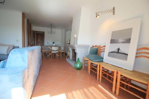 a living room with a table and chairs at Ocean House - First Line of Cabedelo Beach in Viana do Castelo