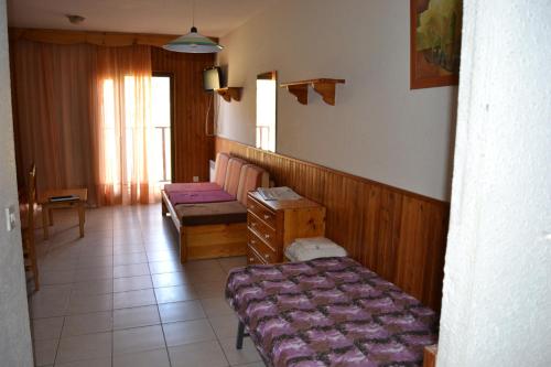 a room with two beds and a window in it at Apartamentos Frontera Blanca Nievesol in Pas de la Casa