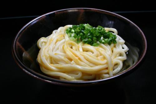 a bowl of noodles with green onions on top at Takamatsu Tokyu REI Hotel in Takamatsu