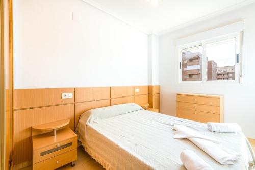 Un pat sau paturi într-o cameră la Vacaciones Oromarina Azahar