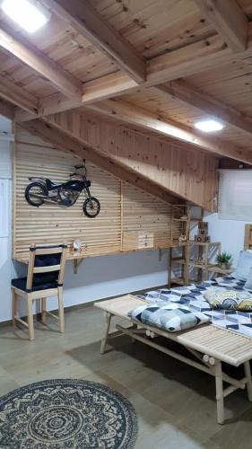 a bedroom with a bunk bed with a motorcycle on the wall at Amazing in Haifa