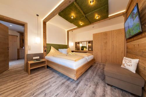 Cama o camas de una habitación en Hotel Sporthof Austria