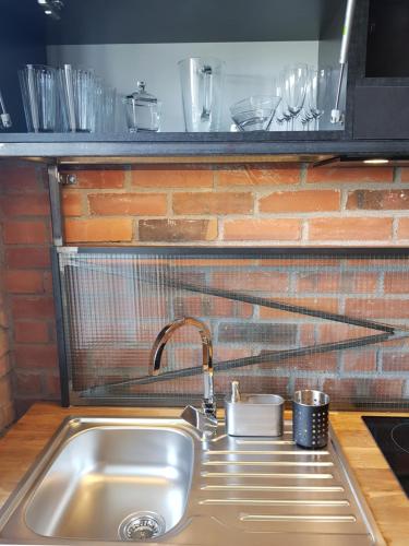 Kuchyň nebo kuchyňský kout v ubytování Apartamenty Folwark Boguszyn
