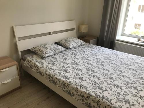 
A bed or beds in a room at Igo apartment Uzupis
