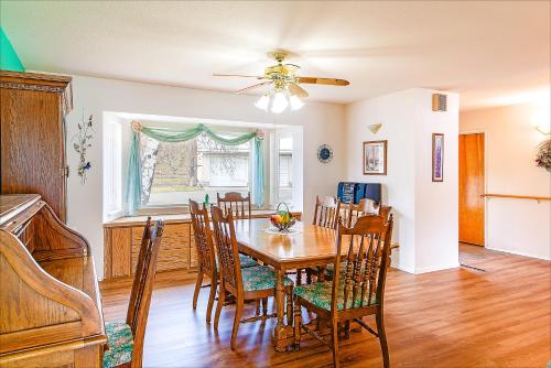a dining room with a table and chairs at Linger Longer Lakeside Cottage in Oroville