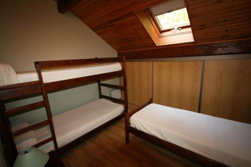 Una cama o camas en una habitación de Gîte ABODI du Chalet Pedro