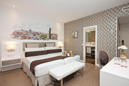 Postel nebo postele na pokoji v ubytování Grupotel Mayorazgo