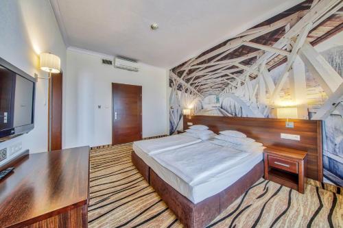 Una cama o camas en una habitación de Hotel Arkas