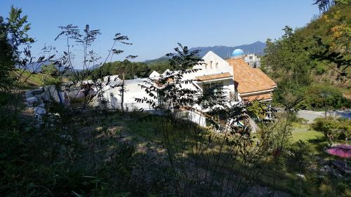 a house on the side of a hill at Saint Paul De Vence in Damyang