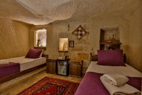 Katil atau katil-katil dalam bilik di Hidden Cave Hotel