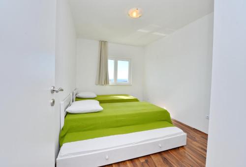 Posteľ alebo postele v izbe v ubytovaní Apartments Verita