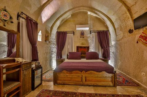 Katil atau katil-katil dalam bilik di Hidden Cave Hotel