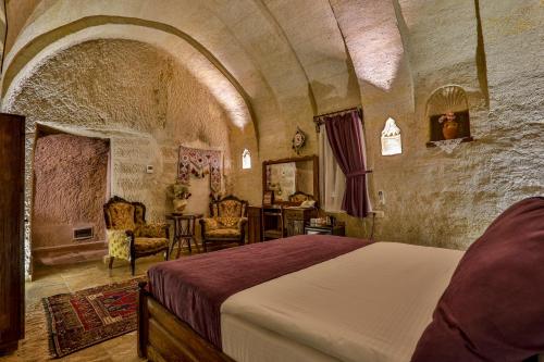 Postel nebo postele na pokoji v ubytování Hidden Cave Hotel