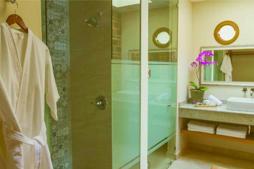 a bathroom with a shower and a sink at Hotel Lindo Ajijic Bed & Breakfast in Ajijic