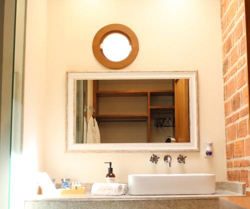 a bathroom with a sink and a mirror at Hotel Lindo Ajijic Bed & Breakfast in Ajijic
