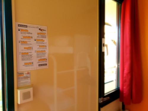 a poster on the wall of a room at Premiere Classe Nancy Est Essey in Essey-lès-Nancy
