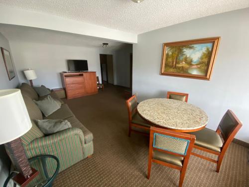 a living room with a couch and a table at Snowshoe Motel in Frisco