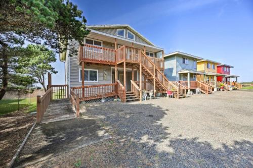 a large house with wooden decks on a street at Sanderling Sea Cottages, Unit 14 in Waldport