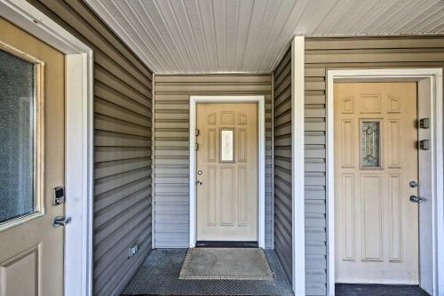 a home with two white doors on a house at Sanderling Sea Cottages, Unit 14 in Waldport