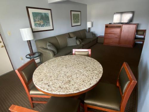 a living room with a table and a couch at Snowshoe Motel in Frisco