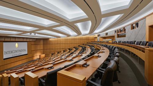 a large lecture hall with rows of tables and chairs at InterContinental Cleveland by IHG in Cleveland