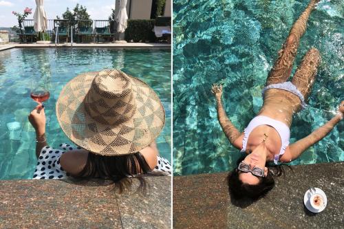 a woman in a hat is swimming in a pool at Villa La Madonna in Monastero Bormida