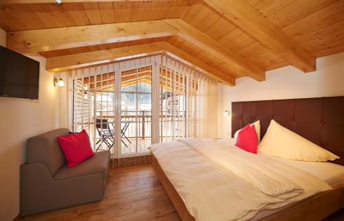 Tempat tidur dalam kamar di Alpine Active Weitgasser
