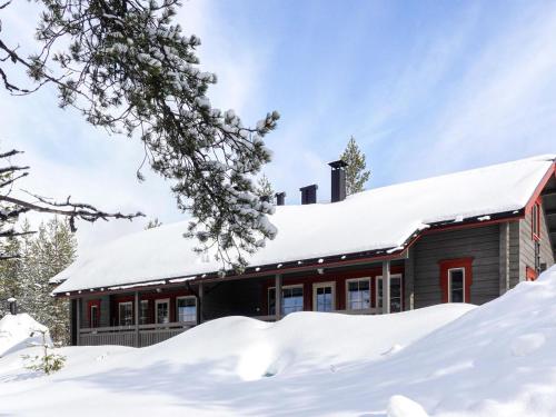 a house covered in snow at Holiday Home Lustola b by Interhome in Luosto